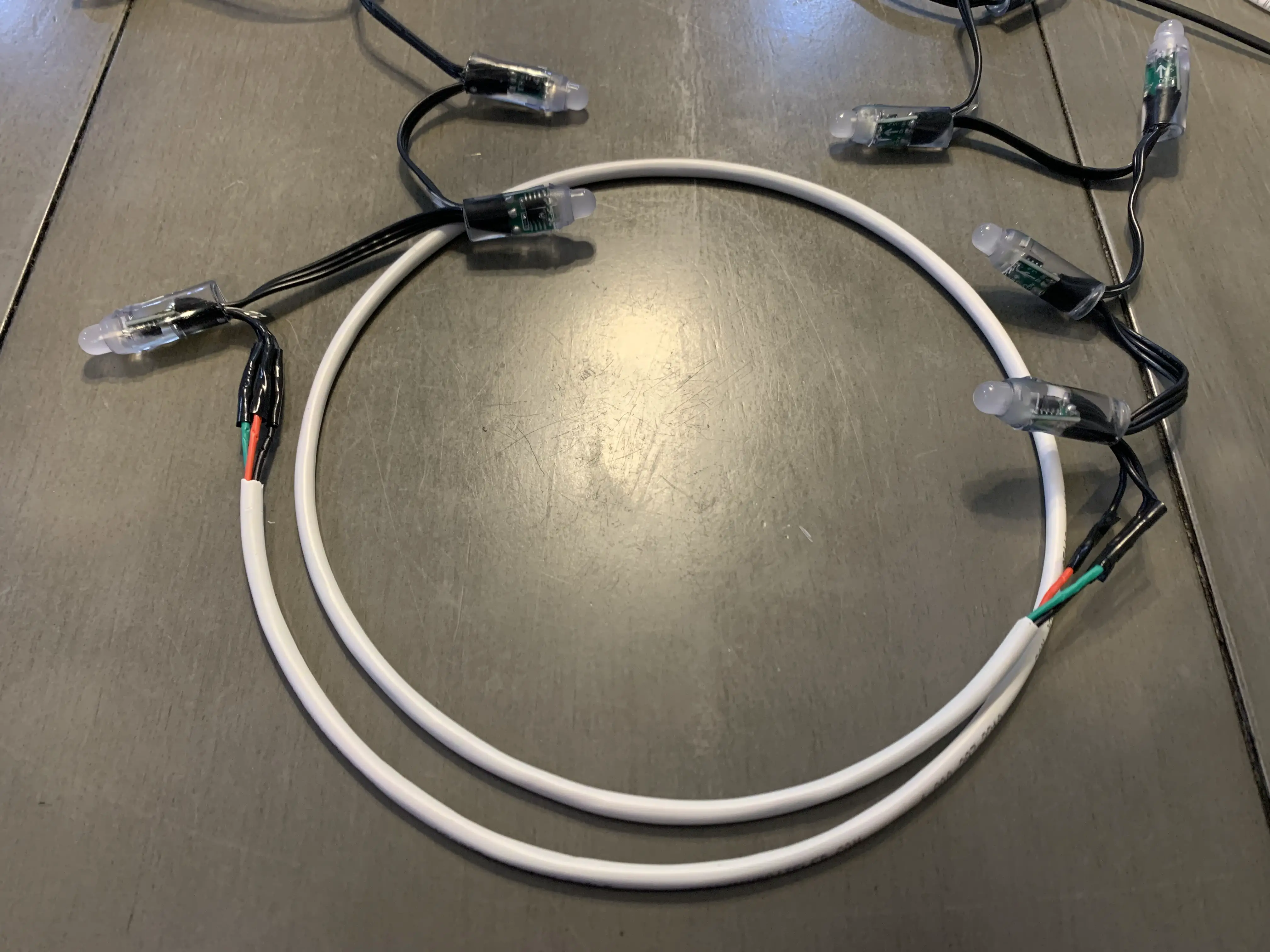 Two strings of LEDs soldered together with 3 wire cable